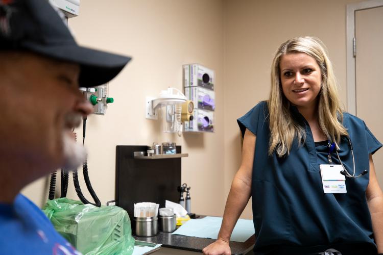 Patient Patrick Fletcher discusses diabetes management with nurse Lindsey Holden, FNP, AG-ACNP.