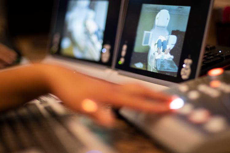 A JPS Health Network Oncology and Infusion Center team member at the controls of the linear accelerator while stereotactic radiosurgery is performed.