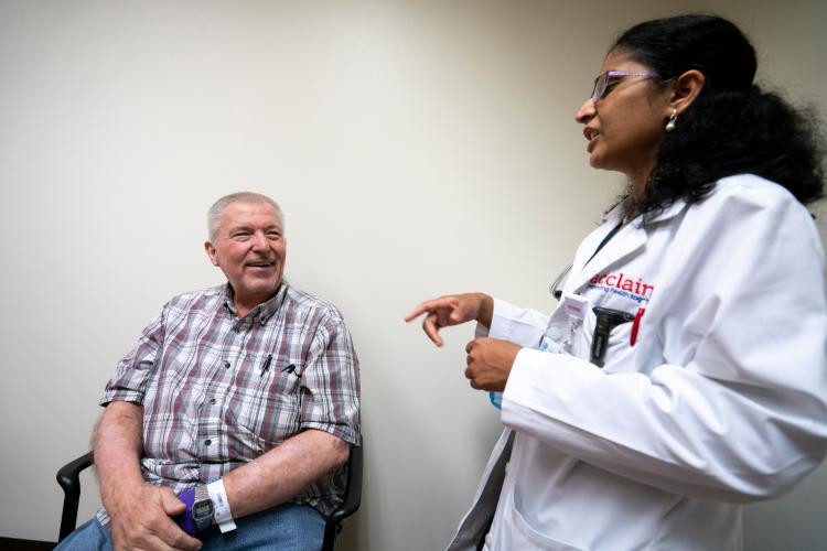 JPS Health Network Oncology and Infusion Center Patient Jerry Bitner discusses his case with Dr. Kalyani Narra